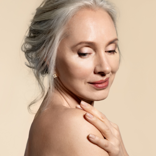 silver haired caucasian woman looking over her shoulder