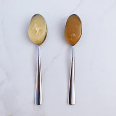 Bjorn's Propolis Honey and manuka honey on spoons 