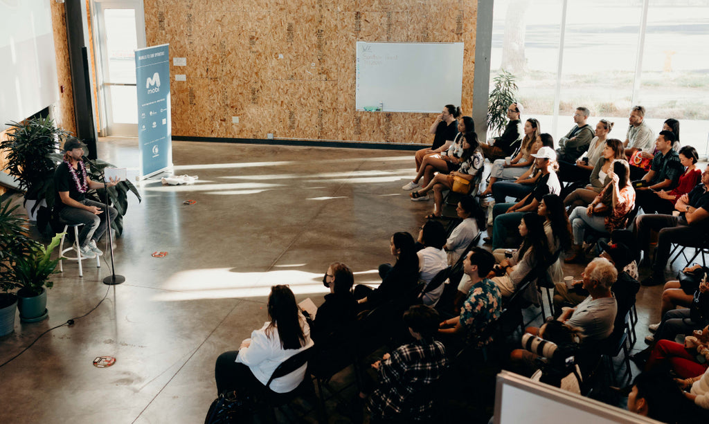 Nick Kuchar gives a speech in front of attendees at Creative Mornings Honolulu