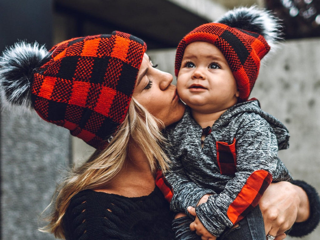 mom and baby with matching buffalo plaid print beanies