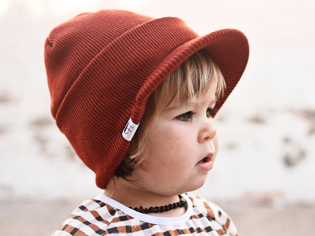Child wearing our Rust Visor Beanie