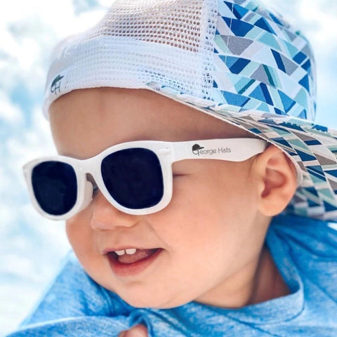 photo of toddler in white sunglasses