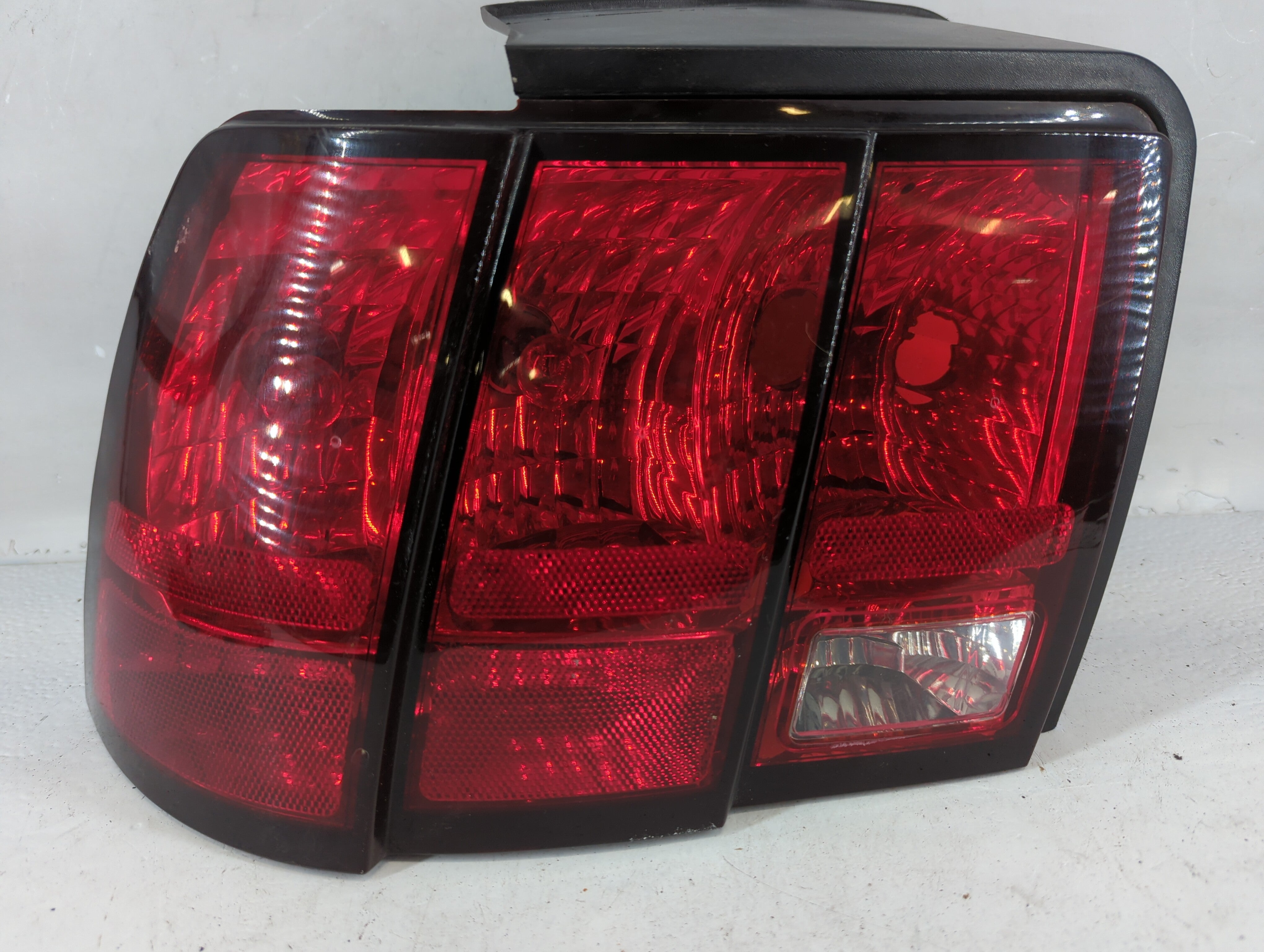 1999-2004 Ford Mustang Tail Light Assembly Driver Left OEM P/N:XR33-13B505-A Fits Fits 1999 2000 2001 2002 2003 2004 OEM Used Auto Parts - Oemusedautoparts1.com