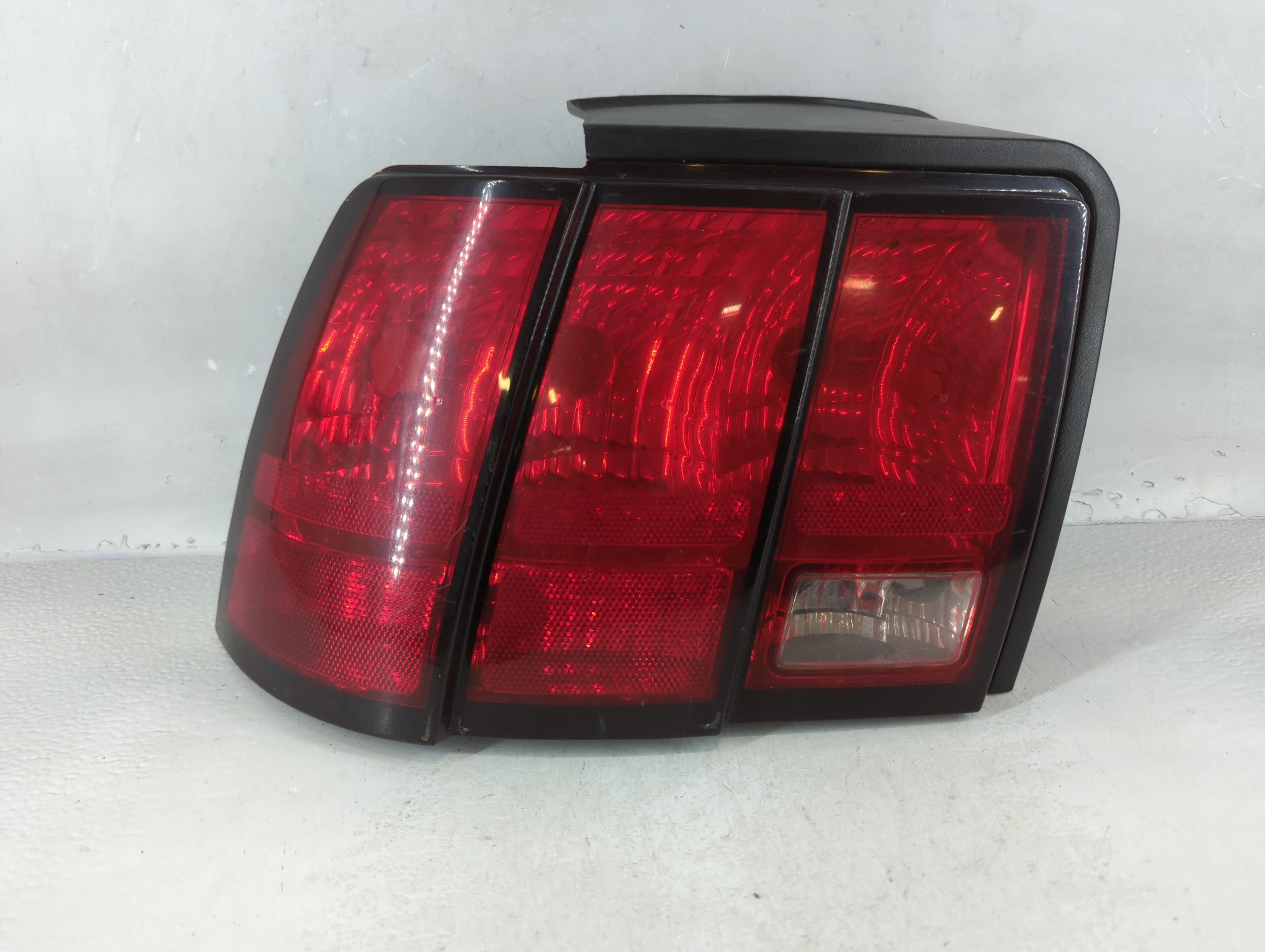 1999-2004 Ford Mustang Tail Light Assembly Driver Left OEM P/N:XR33-13B505-A Fits Fits 1999 2000 2001 2002 2003 2004 OEM Used Auto Parts - Oemusedautoparts1.com