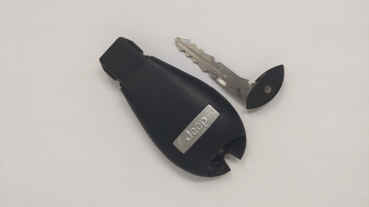 Jeep Cherokee Keyless Entry Remote Fob Gq4-53t 68105083ae 4 Buttons - Oemusedautoparts1.com