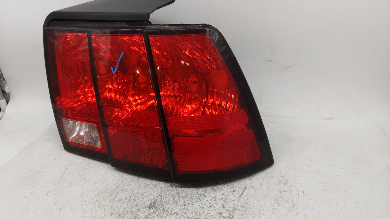 1999-2004 Ford Mustang Tail Light Assembly Passenger Right OEM P/N:XR33-13B504 331-1958R-UC Fits 1999 2000 2001 2002 2003 2004 OEM Used Auto Parts - Oemusedautoparts1.com