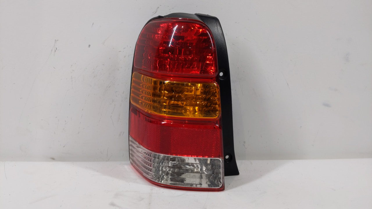 2001-2007 Ford Escape Tail Light Assembly Driver Left OEM P/N:4L84-13B505-D Fits 2001 2002 2003 2004 2005 2006 2007 OEM Used Auto Parts - Oemusedautoparts1.com