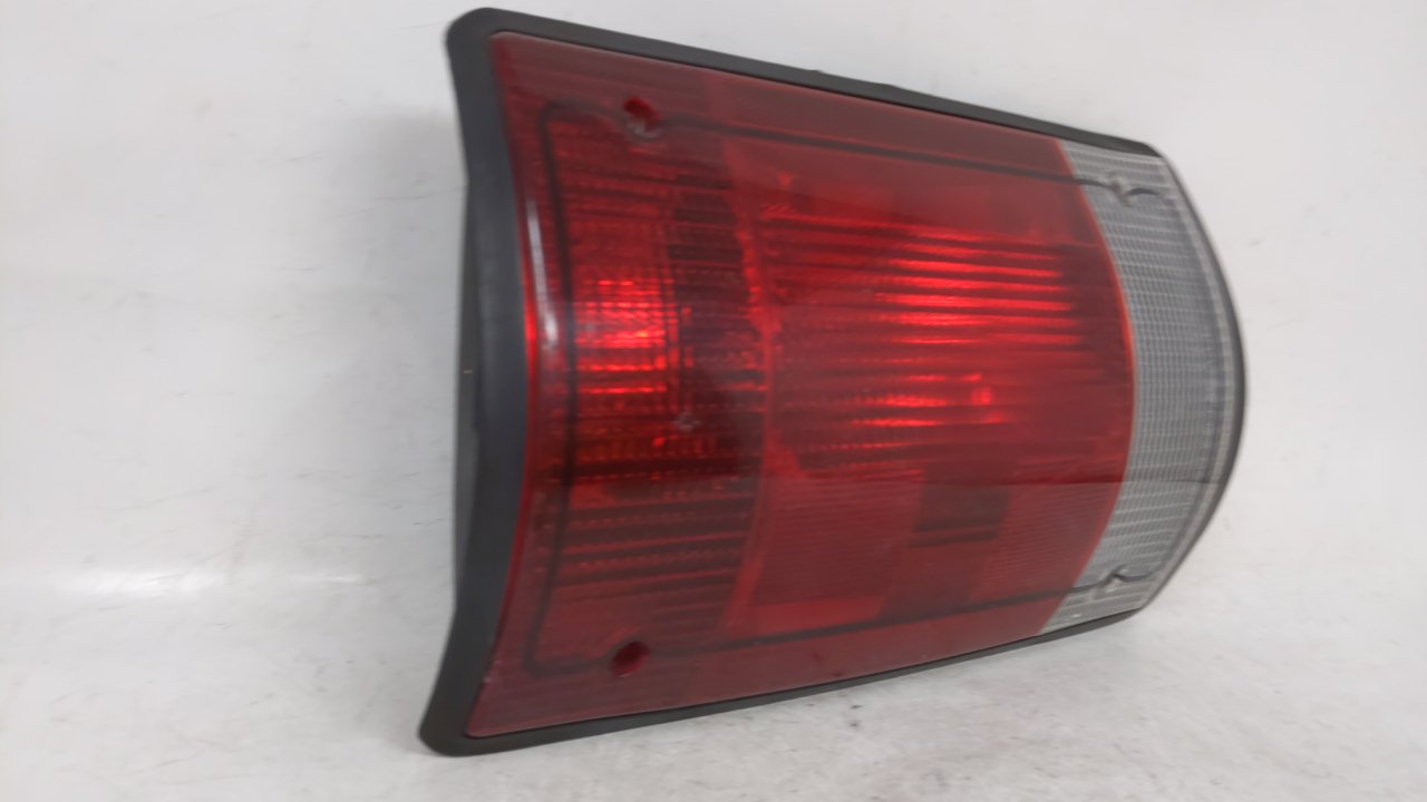 2002-2004 Ford E-150 Tail Light Assembly Driver Left OEM P/N:F7UB-13441-AA Fits 2000 2001 2002 2003 2004 2005 OEM Used Auto Parts - Oemusedautoparts1.com