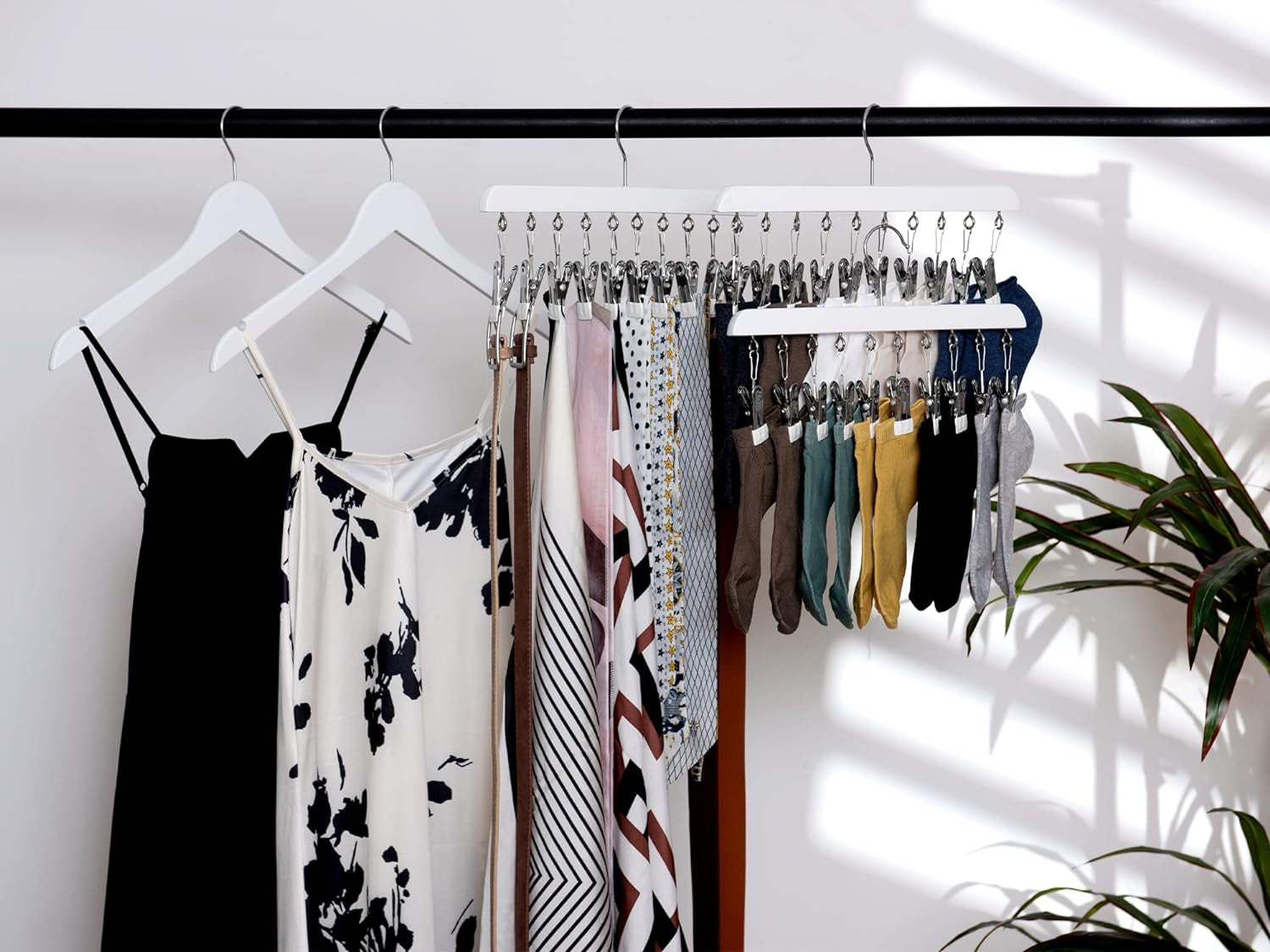 Colorful Wooden Cloth Hangers On Clothes Rail In White Wardrobe