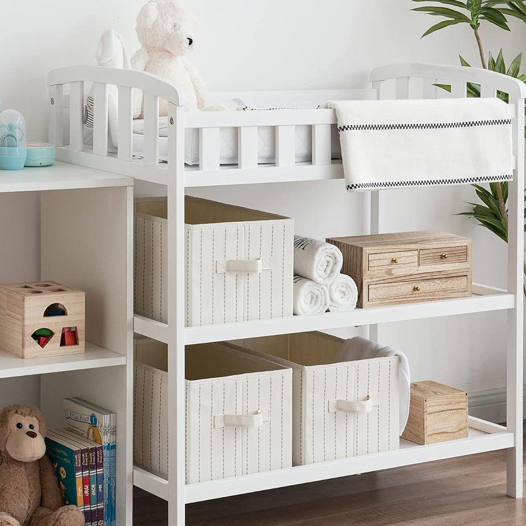 Organize the nursery with fabric storage bins for a cozy and tidy baby room.