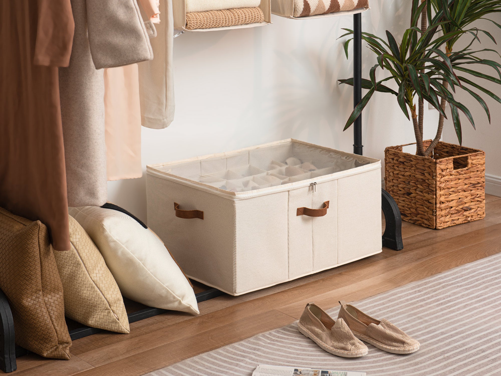 Large beige shoe storage organizer with PU handles featuring adjustable pop-out dividers under a clothes rack
