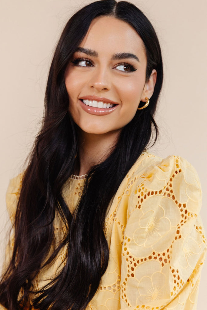 Celebrity Makeup artist, Danielle Estrada wearing Rachel Parcell yellow lace dress