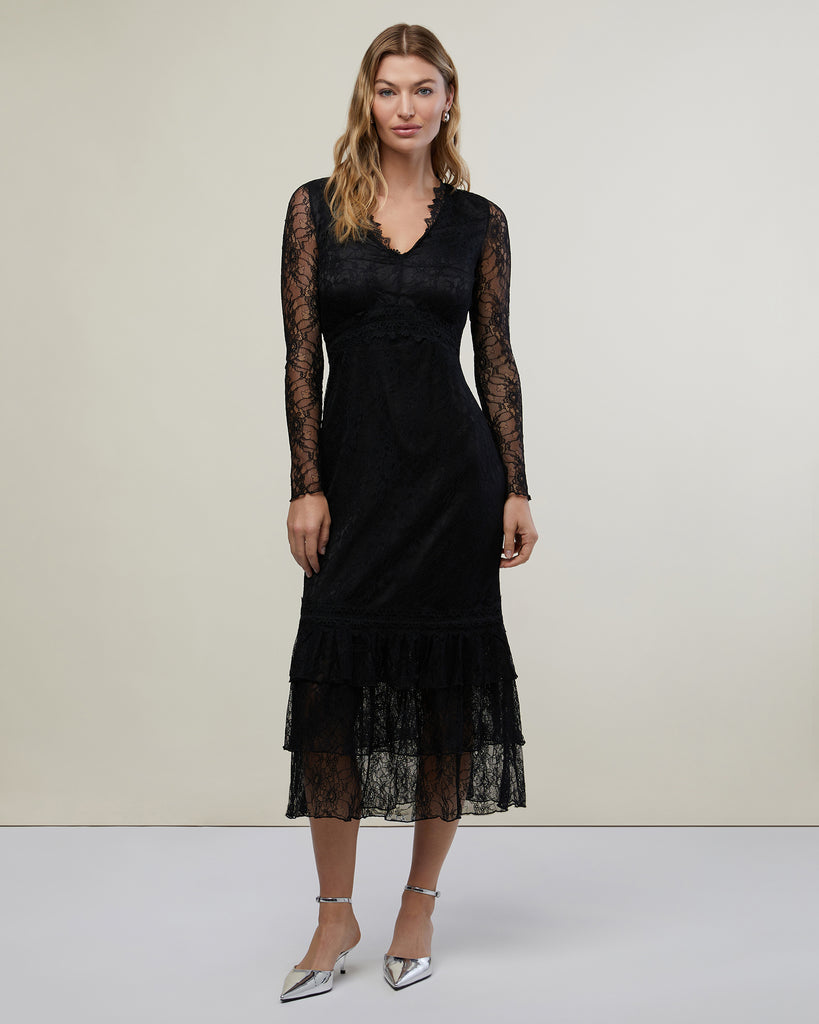 Model in photo studio wearing Black Lace Tiered Midi Dress