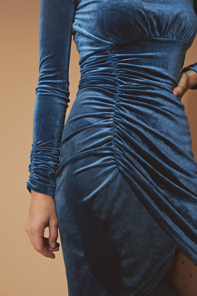 Close up detail shot of model wearing the Deep Teal Ruched Velvet Mock Neck Mini Dress