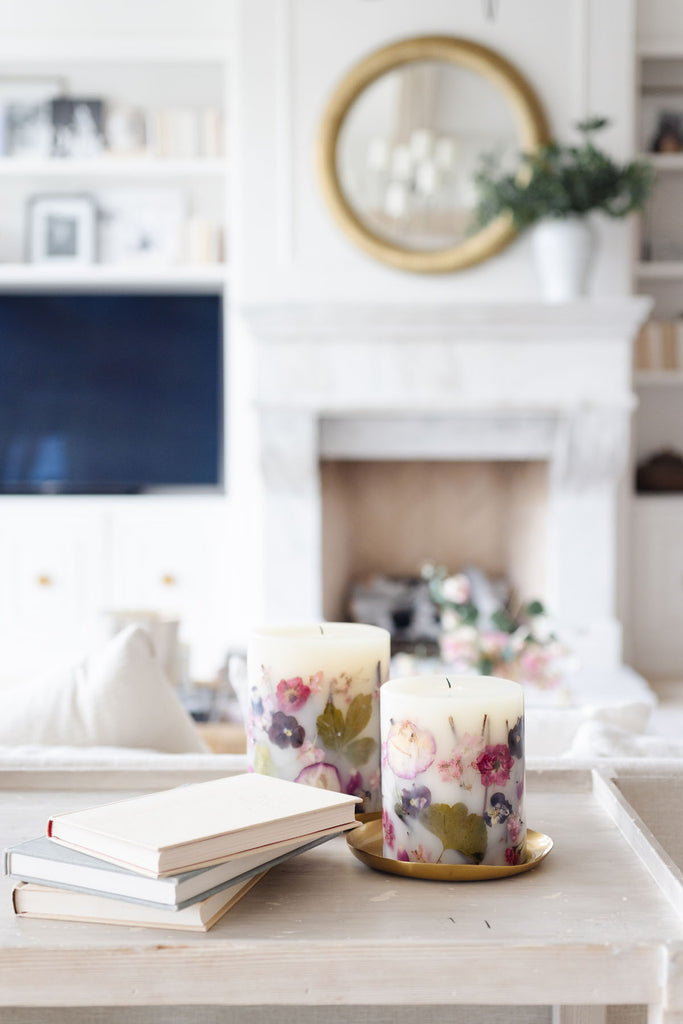 RP Rosy Rings candles next to books in Rachel Parcell's home