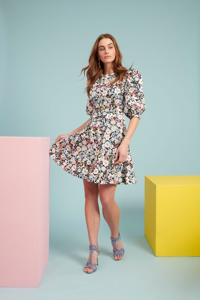 Model wearing Retro Floral Puff Sleeve Fit & Flare Dress