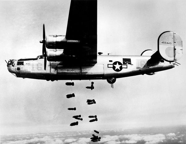 A Consolidated B-24 Liberator of the 15th Air Force releases its bombs over Muhldorf, Germany on March 19, 1945.