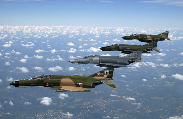 A formation of F-4 Phantom II fighter aircraft in formation over Florida during a flight demonstration commemorating the 50th Anniversary of the U.S. Air Force.