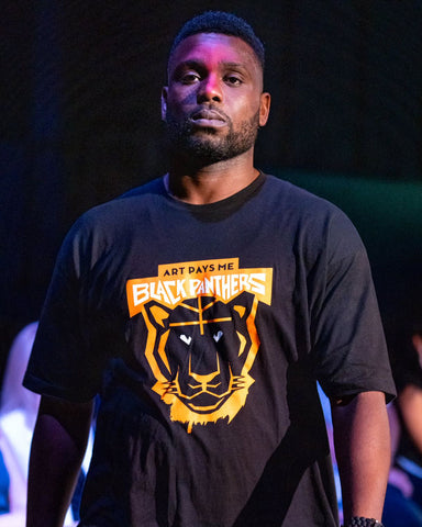 APM Black Panthers Tee worn by Kizito