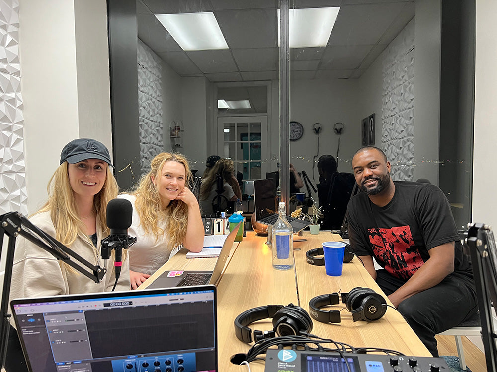 Duane sitting with hosts of Rival & Queen in their recording studio