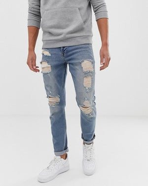 Slim Jeans in Vintage Light Wash Blue with Heavy Rips