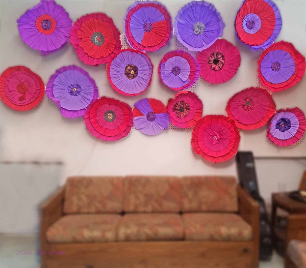 Crepe Paper Flowers above the couch.