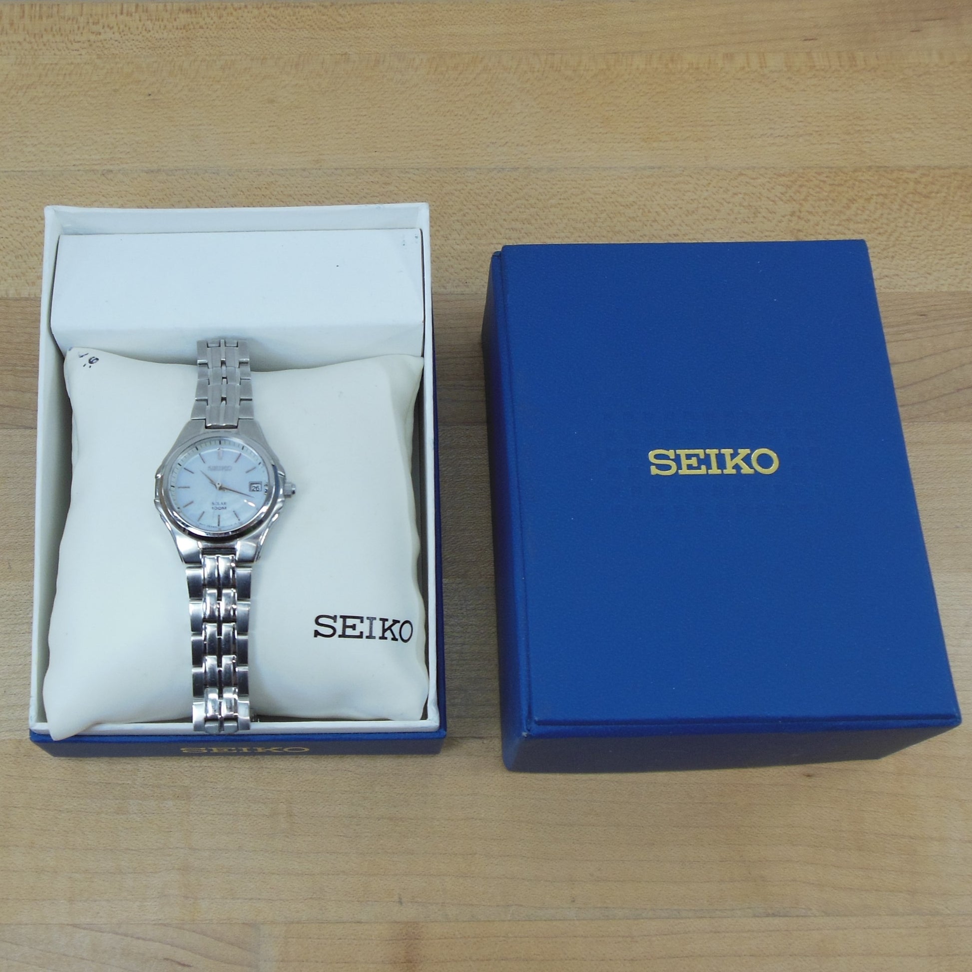 Seiko Women's Solar 100M Dress Watch SUT047 Pearl Stainless – Olde Kitchen  & Home