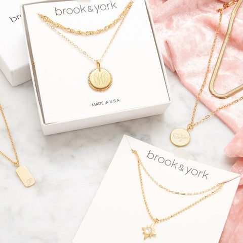Gold layering necklace sets are artfully arranged.