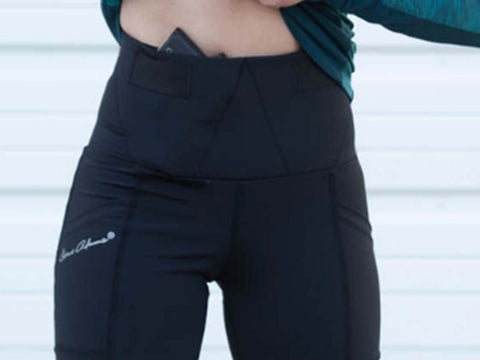 Woman wearing concealed carry capri leggings. 