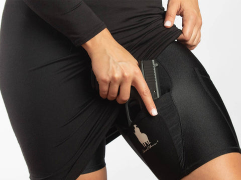  Woman wearing concealed carry shorts under a skirt. 