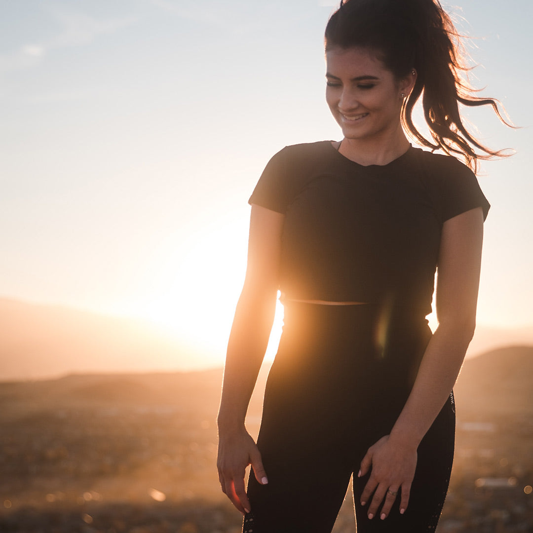 image of woman at autumn sunset