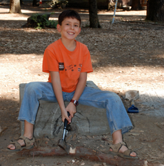 Zach Zeiter at age nine chopping firewood while camping with his family in the Redwoods of Northern California.