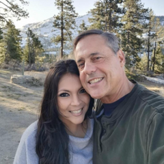 Philip Zeiter and Karen Marmol. Middle-aged couple in Lake Tahoe taking a smiling selfie.