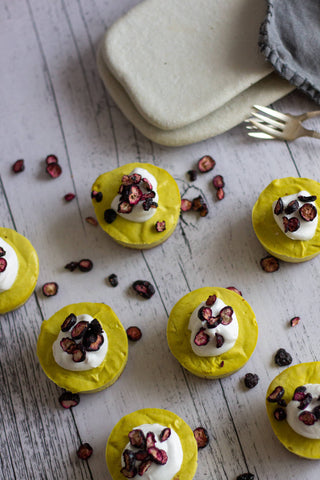 Raw Mango Cheesecake by Freya's Nourishment. Topped with coconut yoghurt and freeze dried blueberries