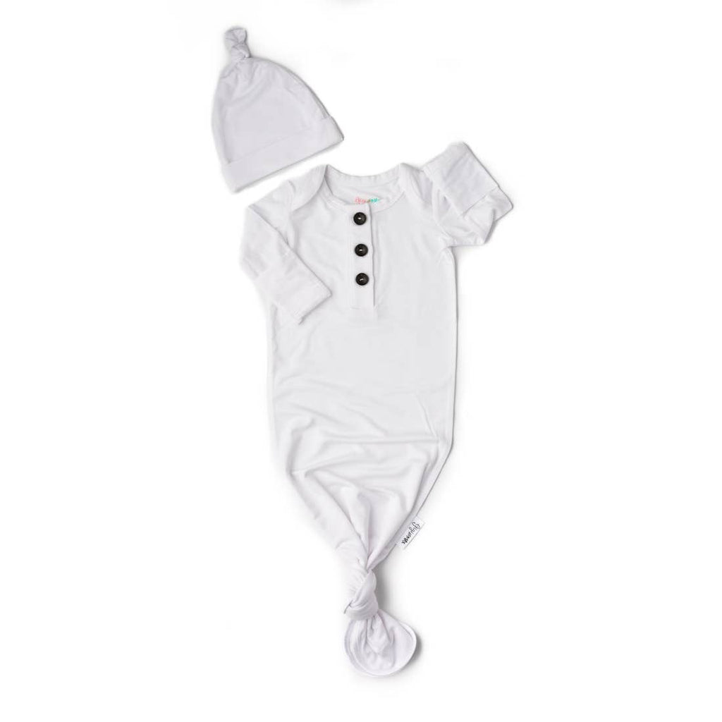 white newborn gown and hat