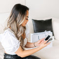 photo of a girl looking at lash extension trays