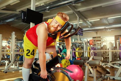 Bearded guy sleeping at gym