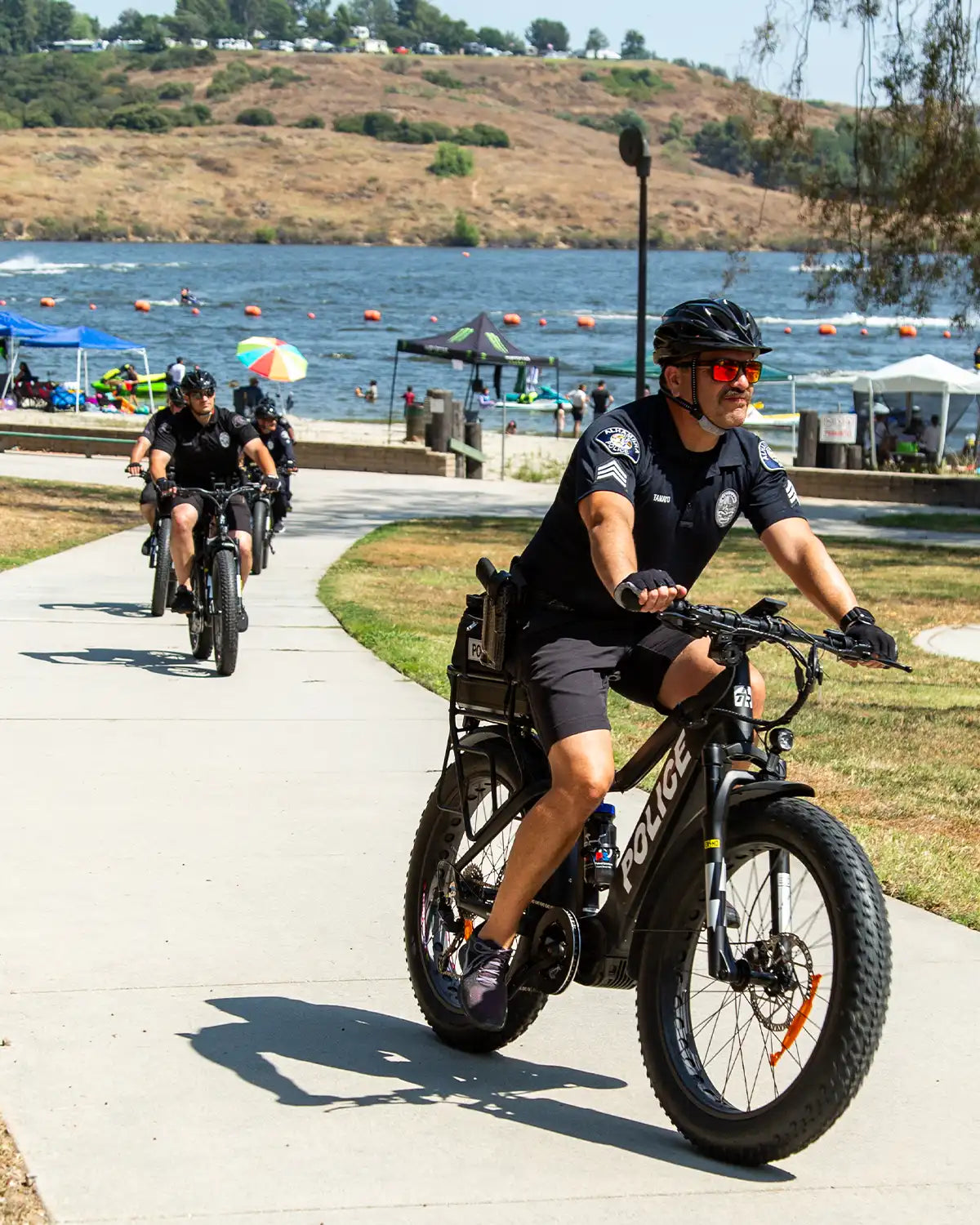 Police Officers Patrolling a Crowded Beach on the ATR 528 Police eBike