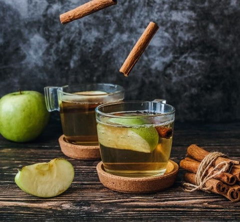 Hot apple cider with maple syrup and cinnamon