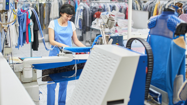 Woman dry cleaning