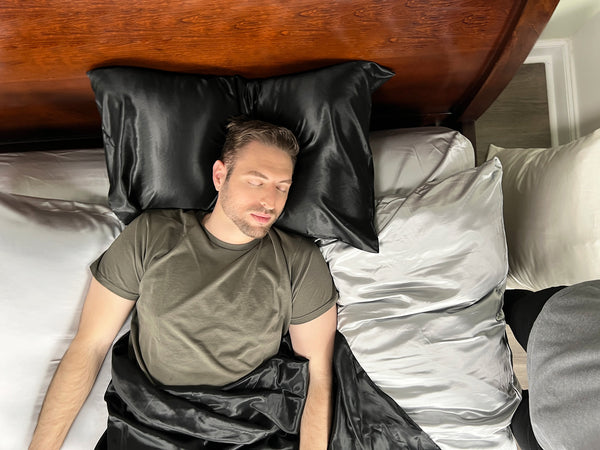 Man sleeps on silk bedding