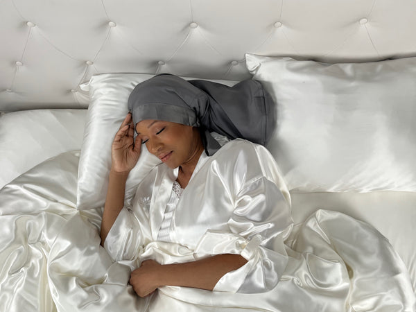 model wears gunmetal sleep bonnet