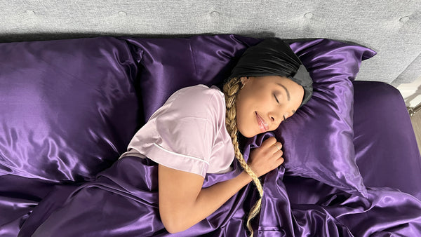 Model sleeps in Silk headscarf in black