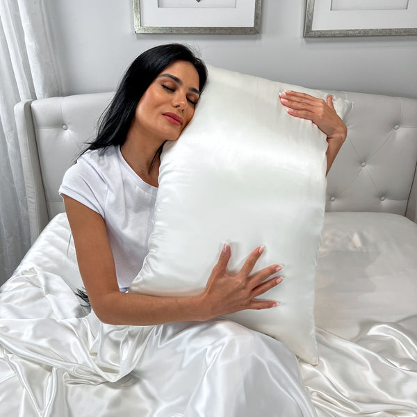 Model Holding White Silk Pillowcase
