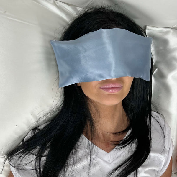Model uses lavender eye pillow in steel blue
