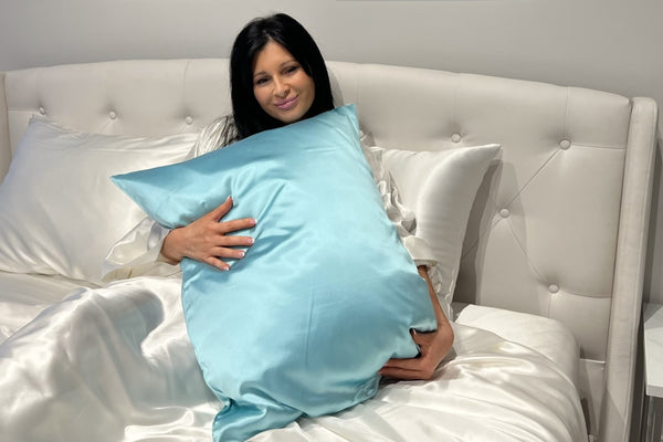 Model holds Silk Pillowcase