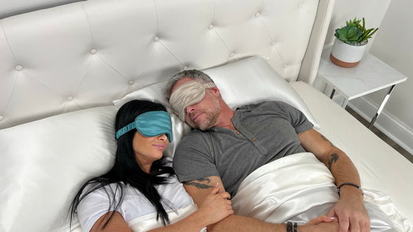 Couple wearing silk sleep masks