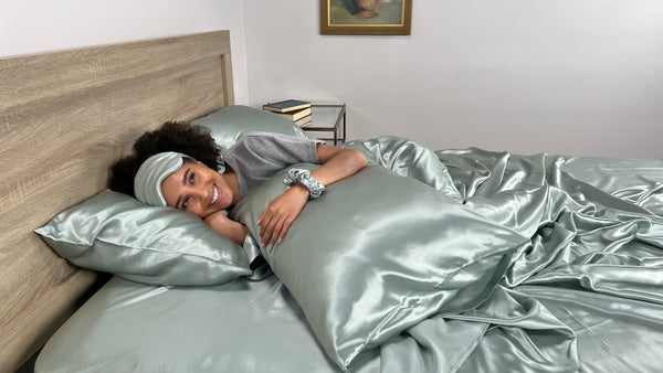 Woman Lies in Silk Bedding