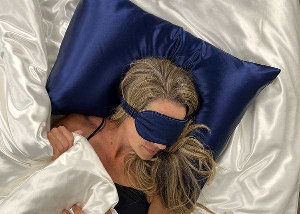 Model Sleeps on Navy Pillowcase