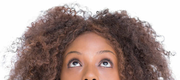 Women looking up with frizzy hair